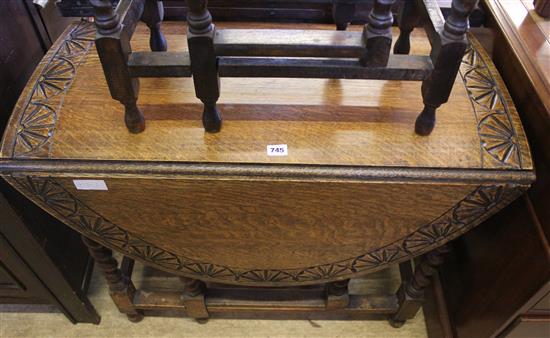 Carved oval oak gateleg table